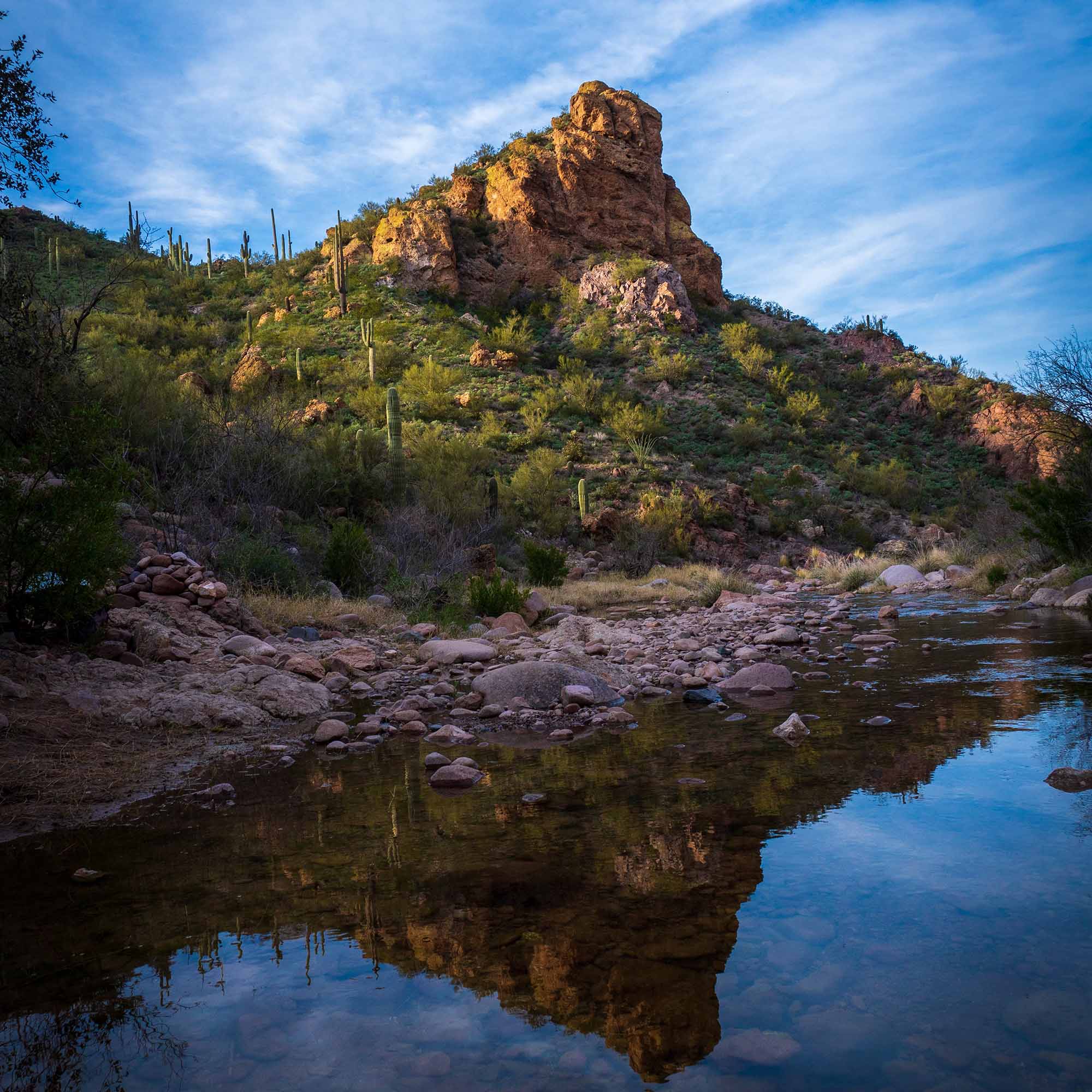 A mountain reflected in a river of water